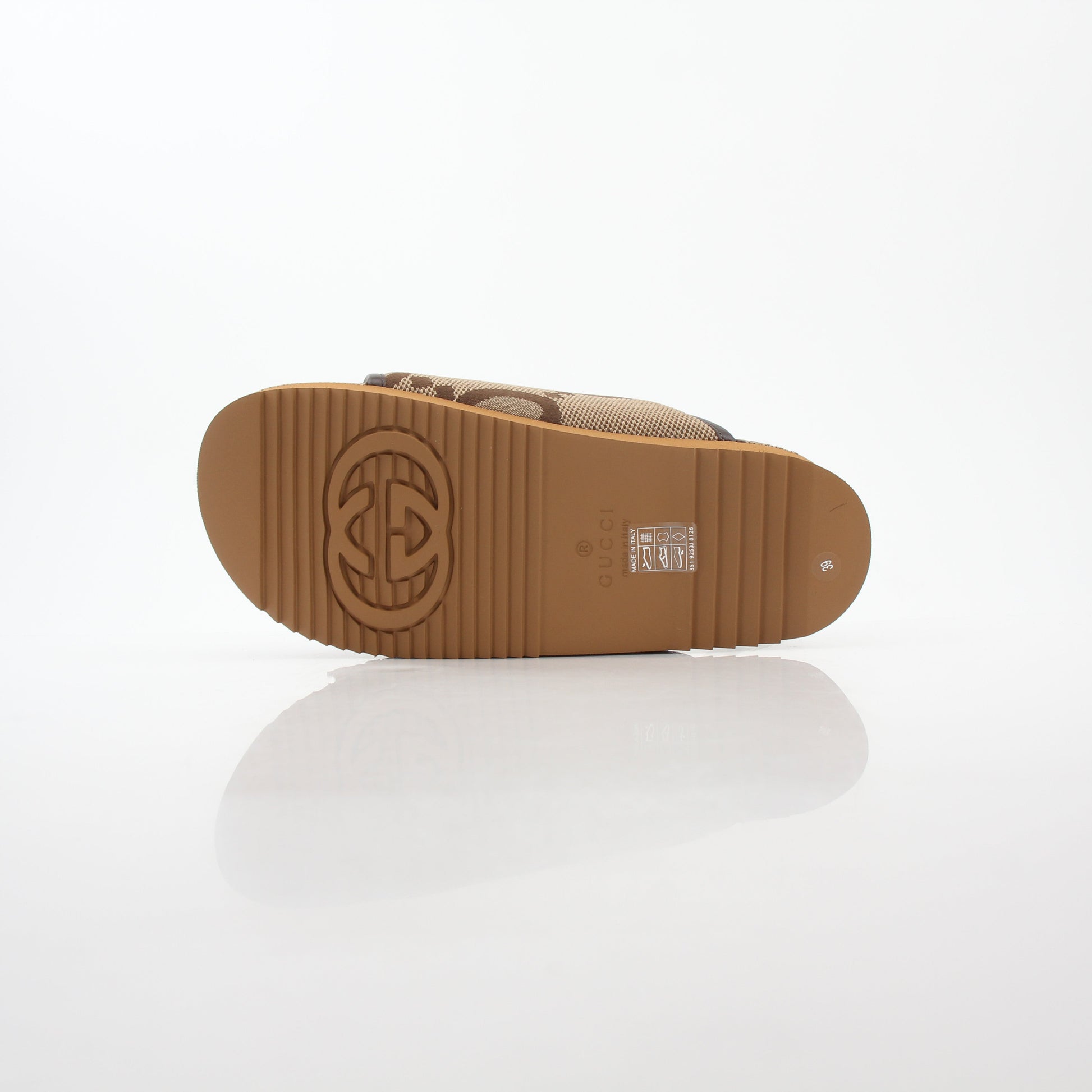 Gold & Beyond Gucci brown maxi GG platform slide sandals, stylish shoes with bold print and comfortable slip-on design.