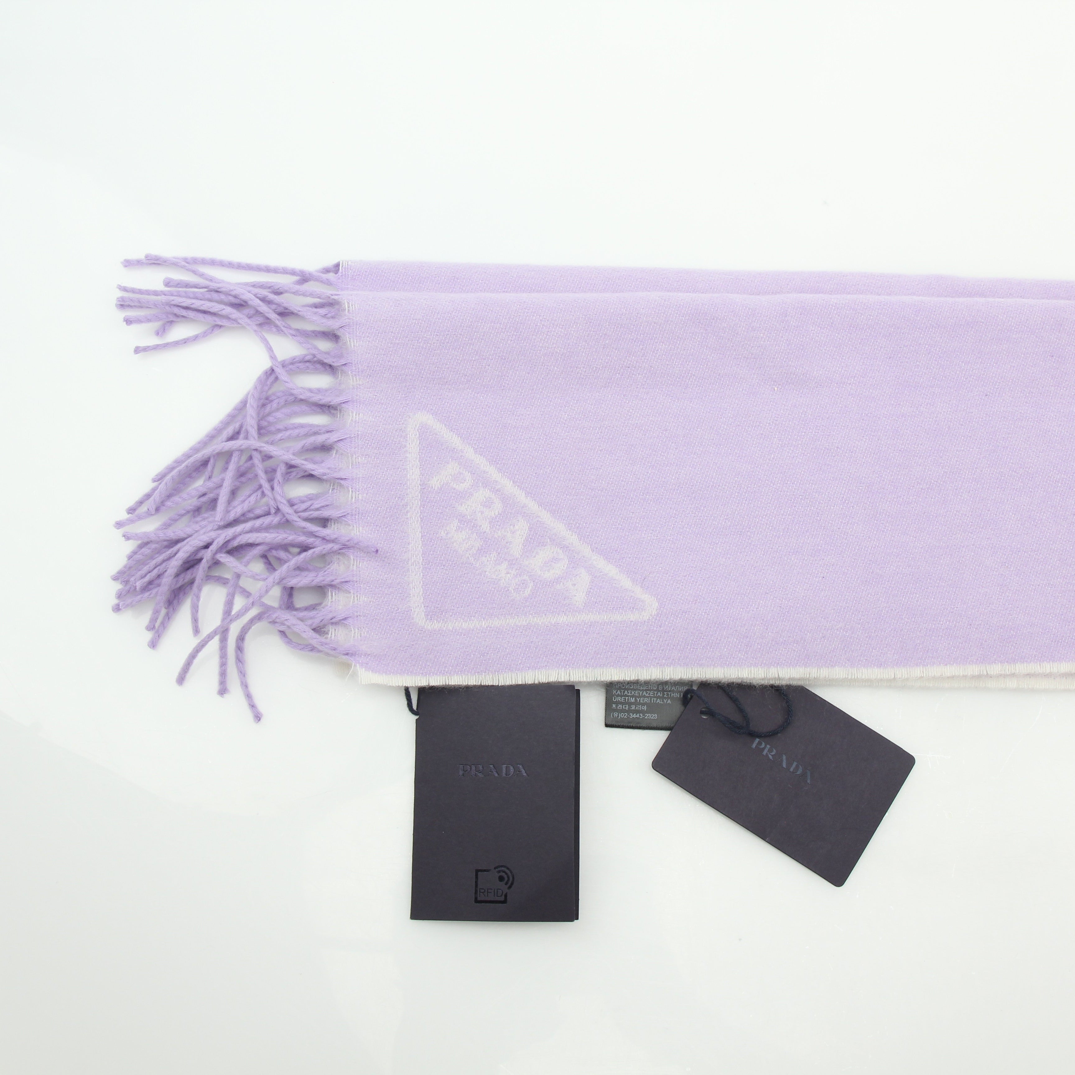 Prada lavender logo jacquard cashmere scarf with gold accents, stylish accessories featuring a soft, luxurious texture.