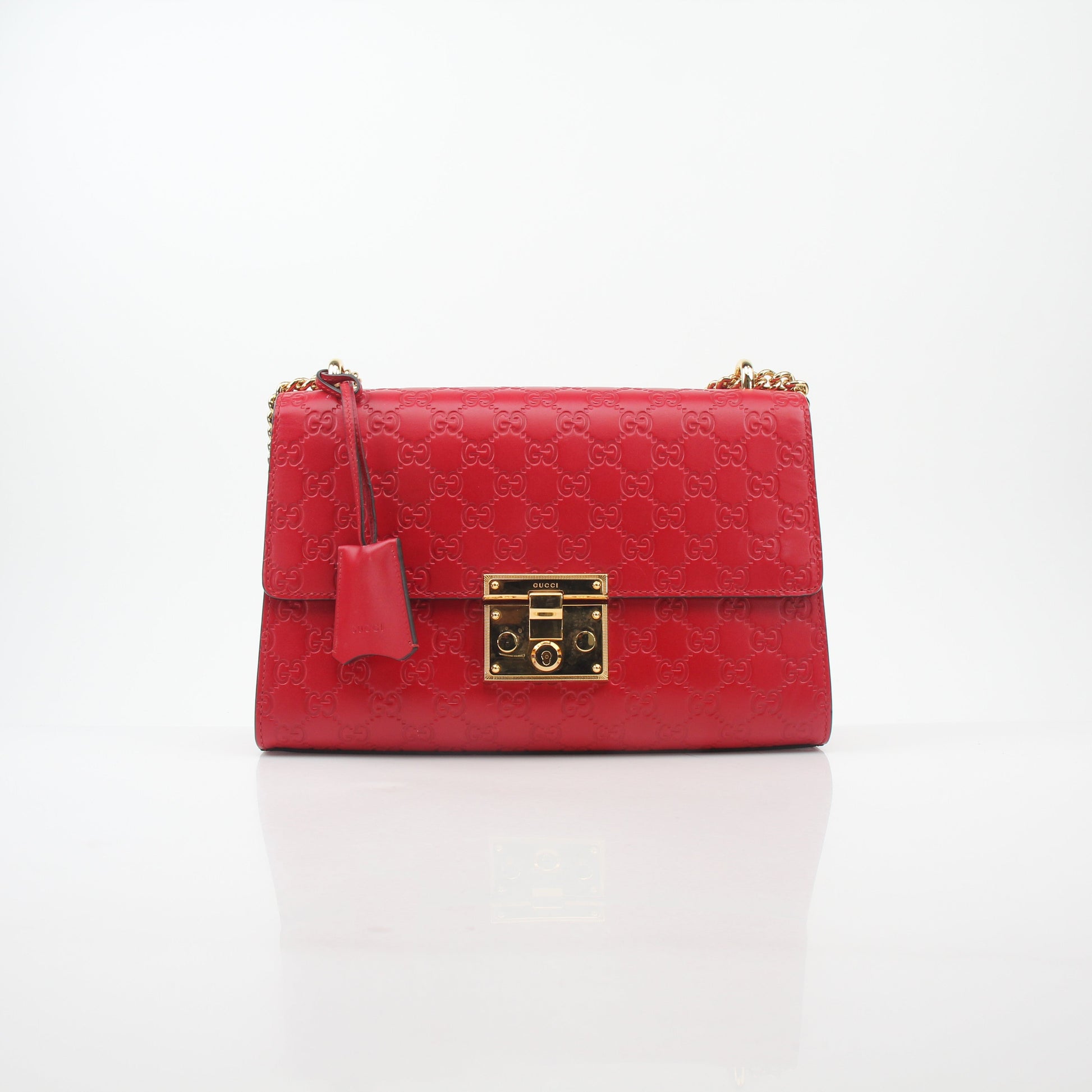 Gucci red GG signature padlock medium shoulder handbag with gold hardware and adjustable strap, stylish and iconic designer bag.