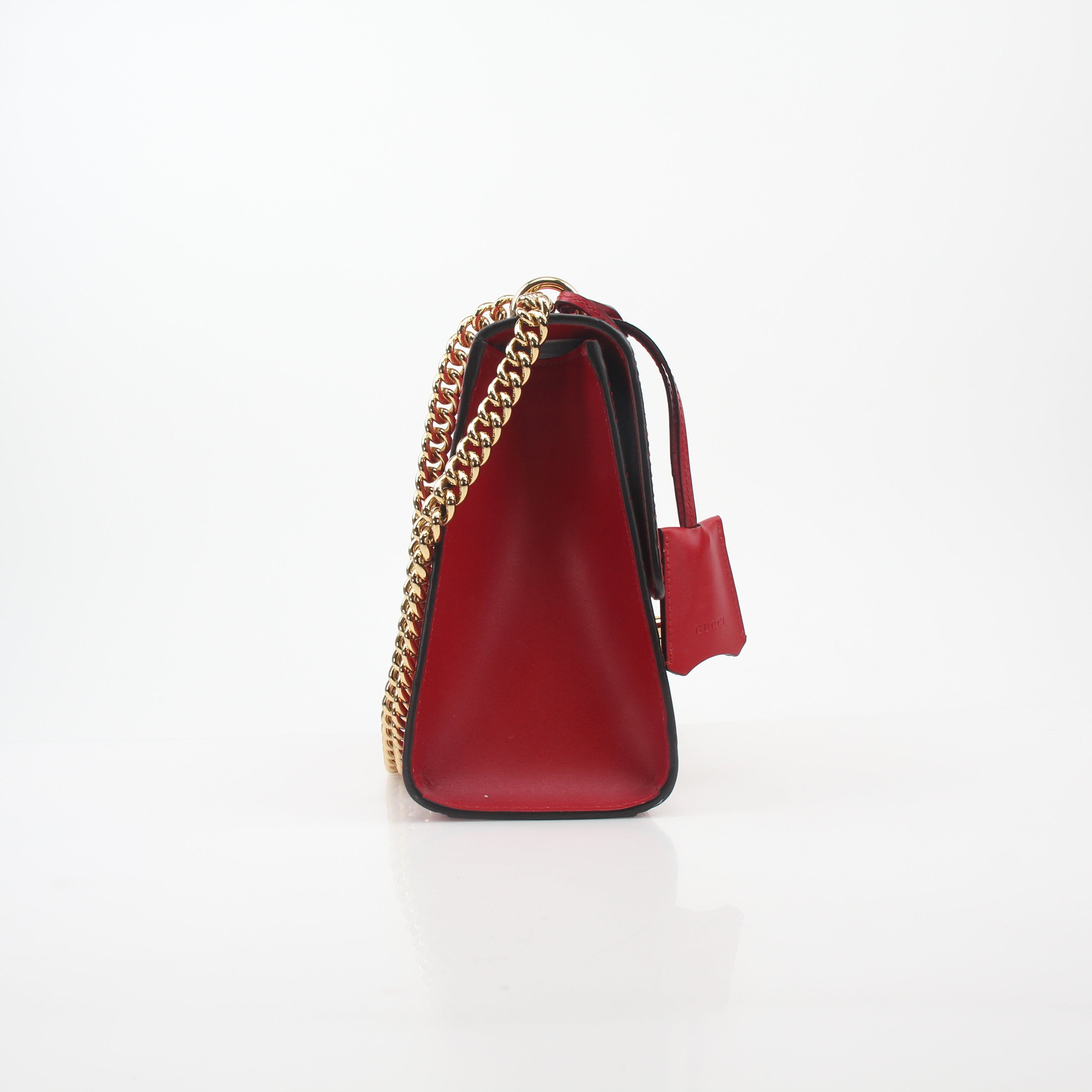 Gucci red GG signature padlock medium shoulder handbag with gold-tone hardware and adjustable strap, stylish and iconic design.