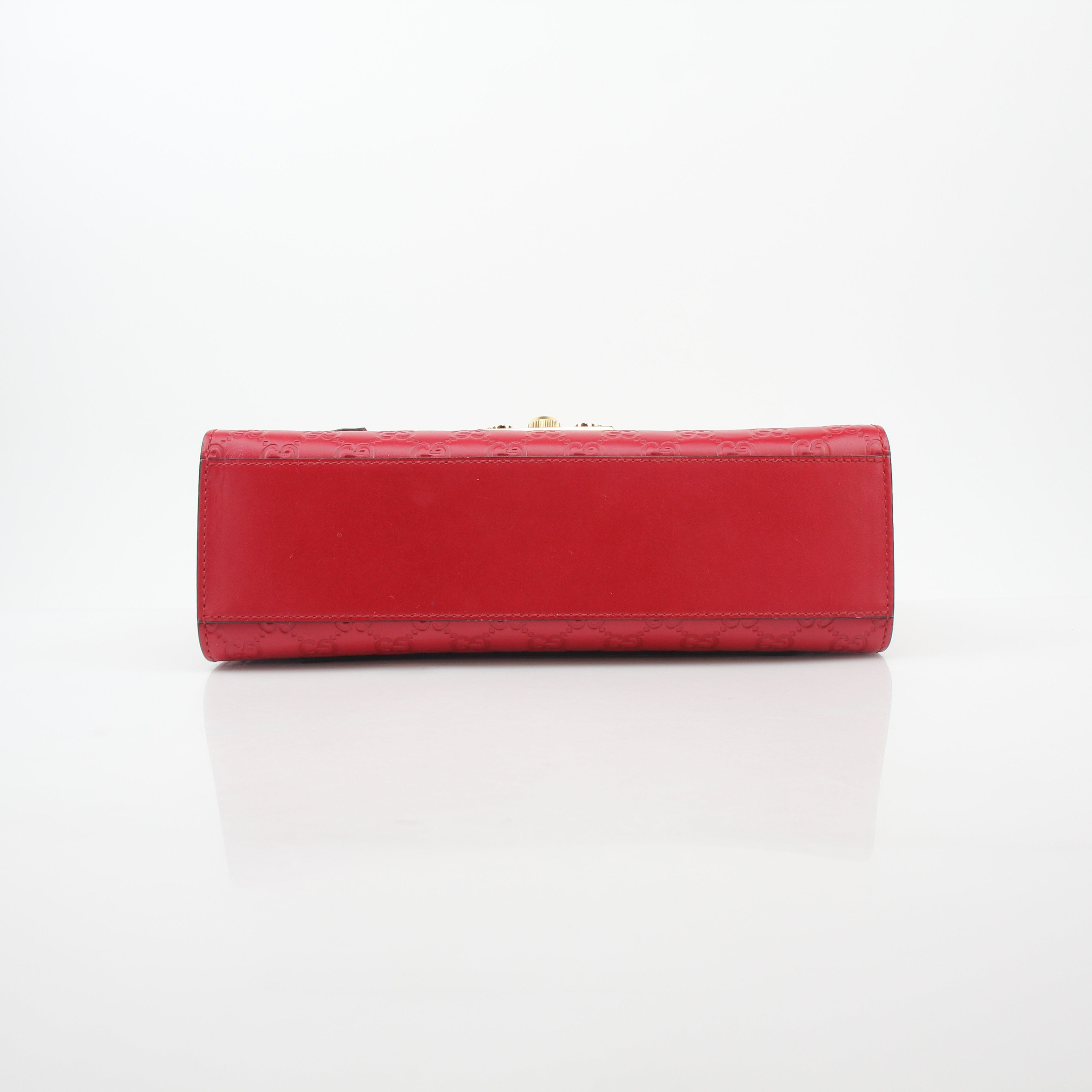 Gucci red GG signature padlock medium shoulder handbag with gold hardware and adjustable strap.