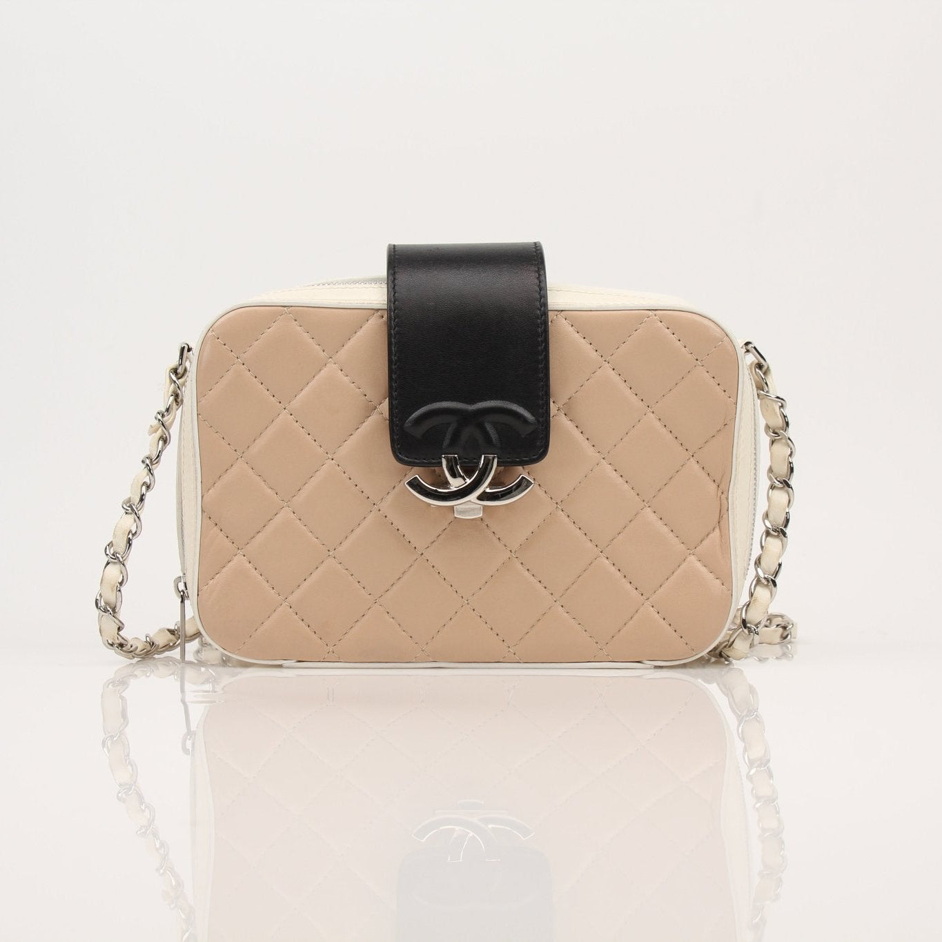 Gold & Beyond Chanel Two-Tone Quilted Mini Flap Handbag with gold chain strap and classic quilted design.