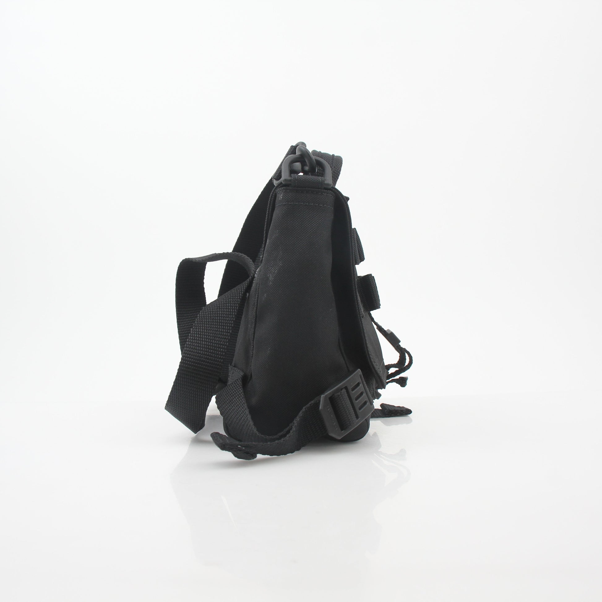 Black Balenciaga Army Messenger Bag by Gold & Beyond, featuring a sleek design with adjustable strap and detailed logo accents.