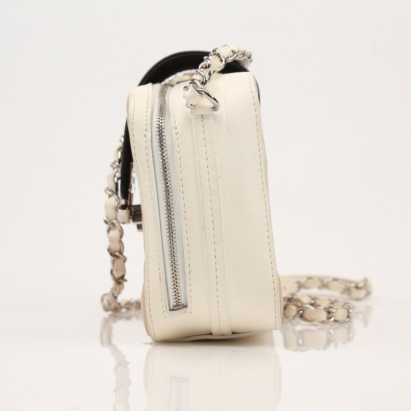 Gold & Beyond Chanel two-tone quilted mini flap handbag with gold chain strap and signature quilted pattern.