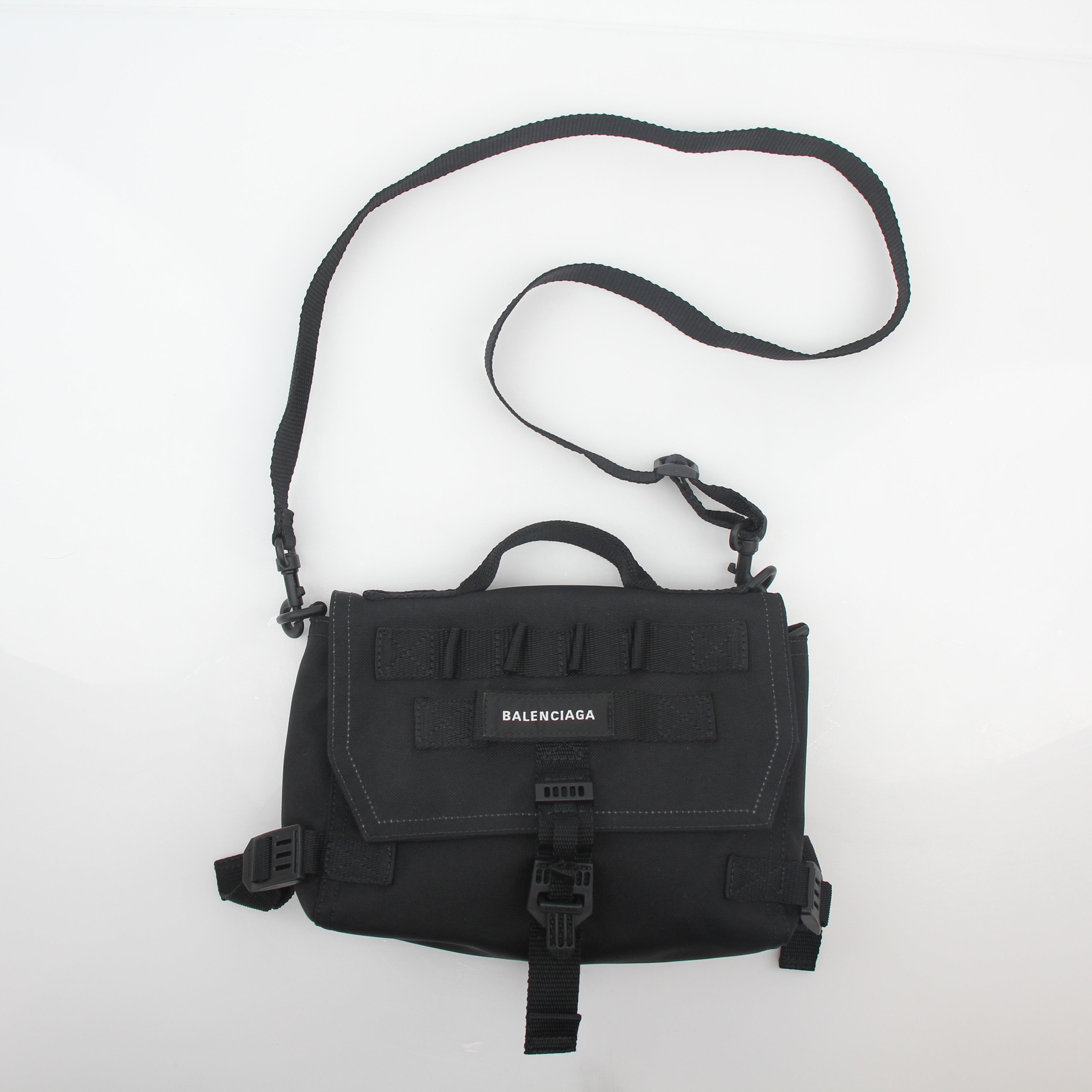 Black Balenciaga Army Messenger Bag, Gold & Beyond handbag with adjustable strap and structured design, displayed on a plain background.