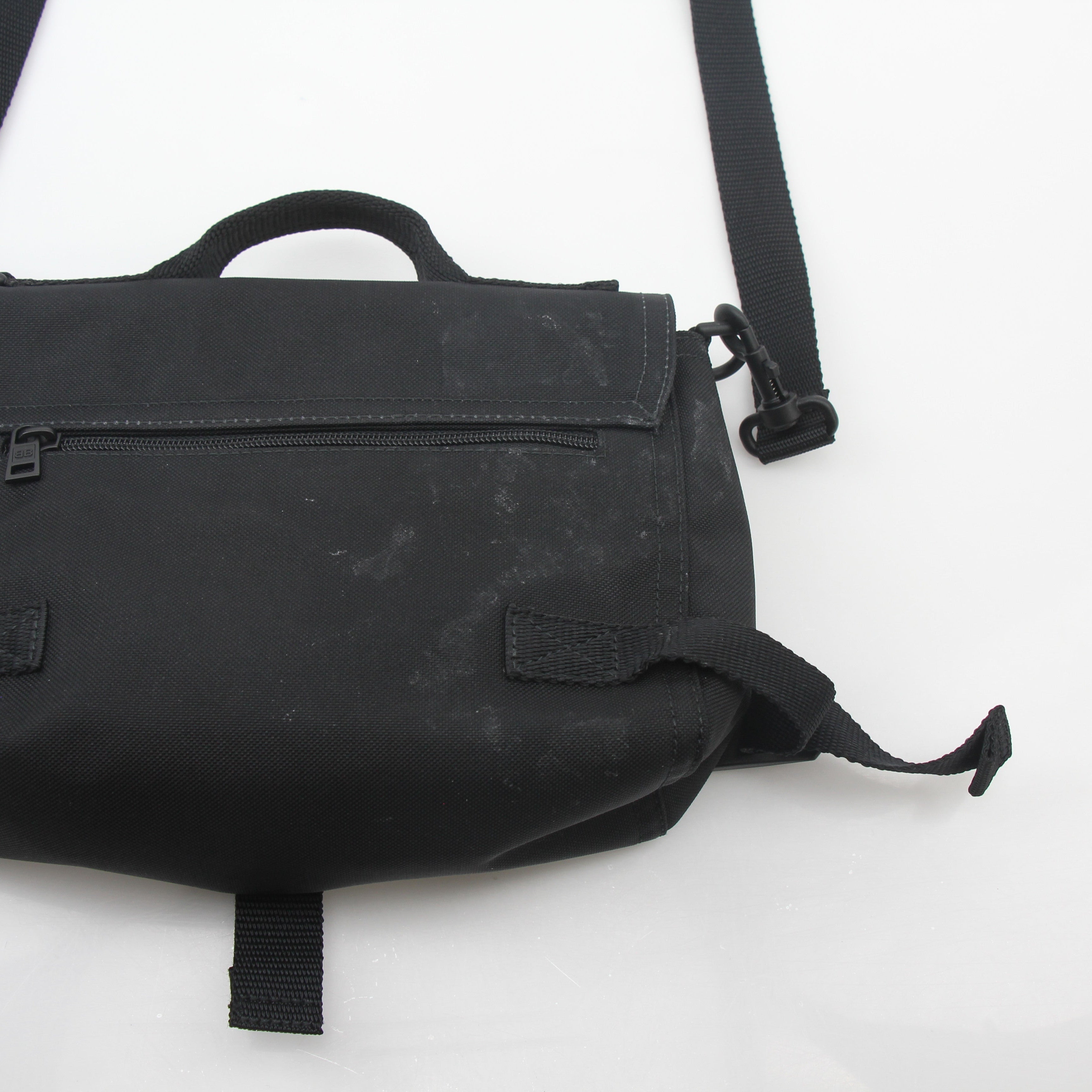 Black Balenciaga Army Messenger Bag by Gold & Beyond, showcasing the handbag with adjustable strap and sleek design.