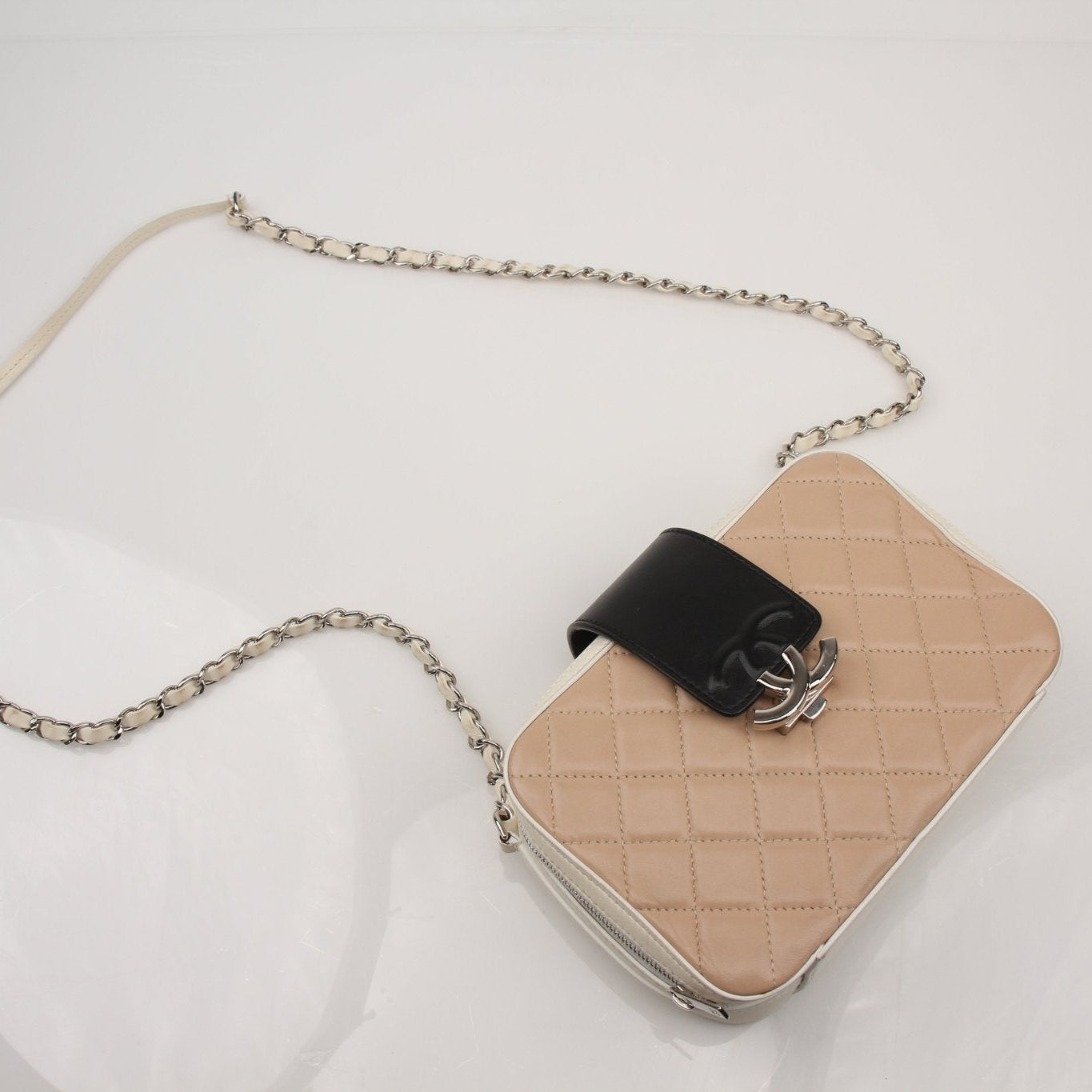 Gold & Beyond Chanel two-tone quilted mini flap handbag with gold chain strap and signature quilting design.