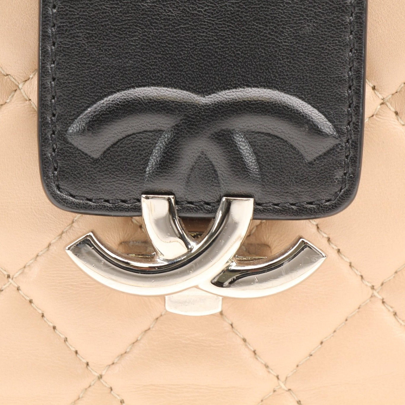Gold & Beyond Chanel two-tone quilted mini flap handbag with gold chain strap and signature quilting detail.