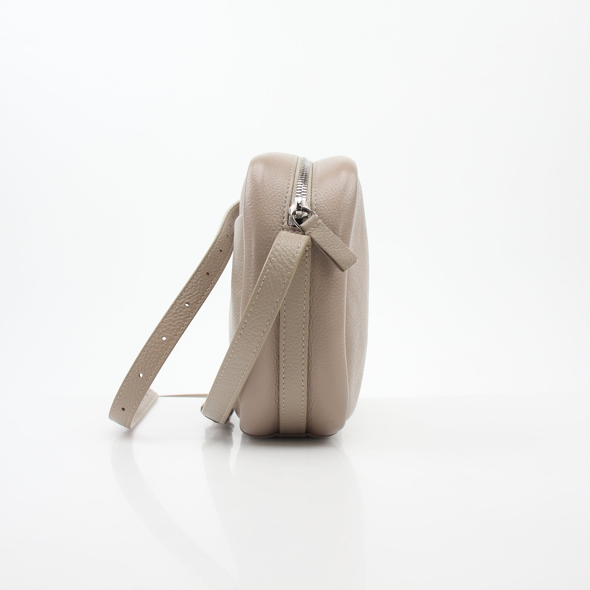 Beige Balenciaga Everyday Camera Bag handbag with gold accents, stylish and functional for everyday use.