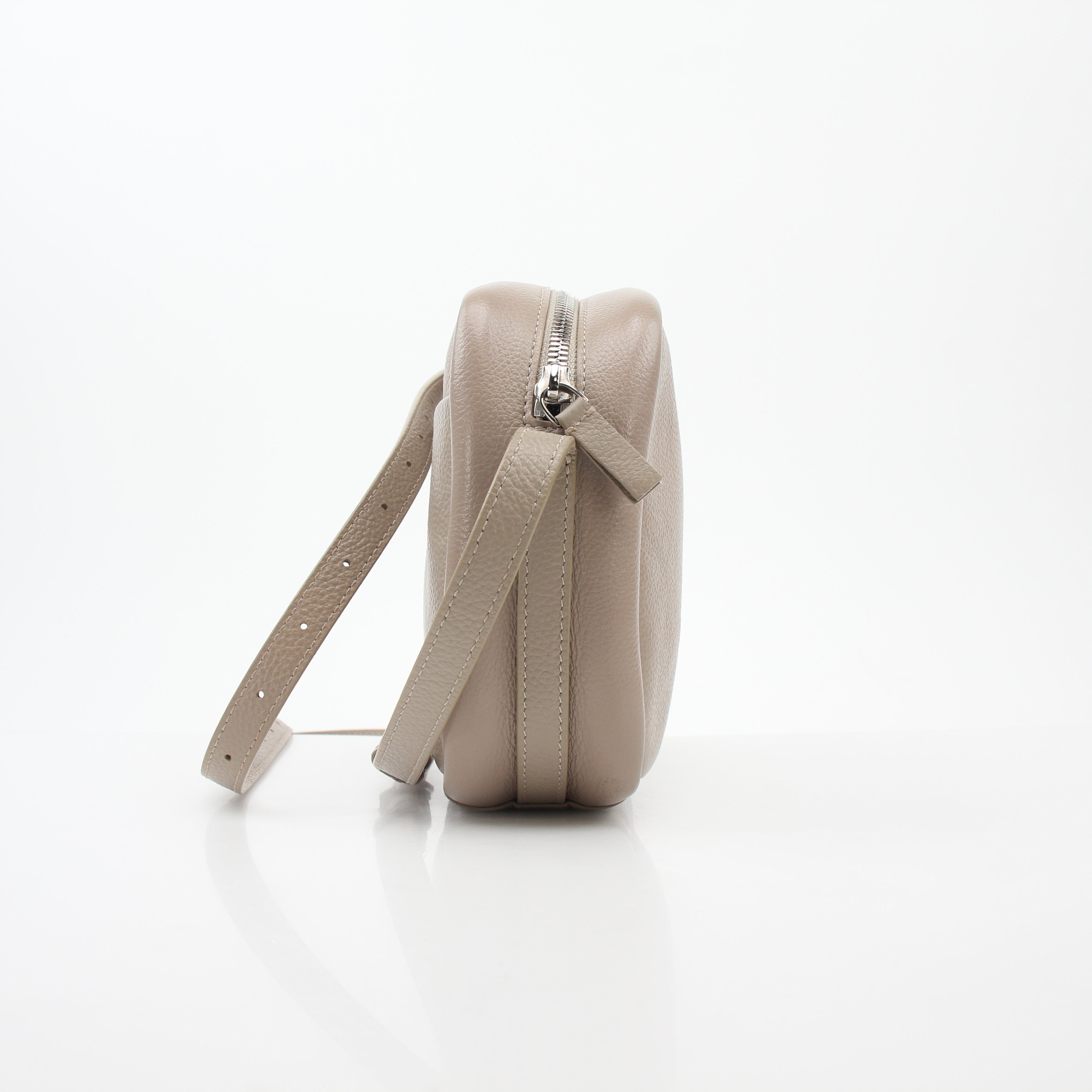Beige Balenciaga Everyday Camera Bag handbag with gold accents, stylish and functional for everyday use.