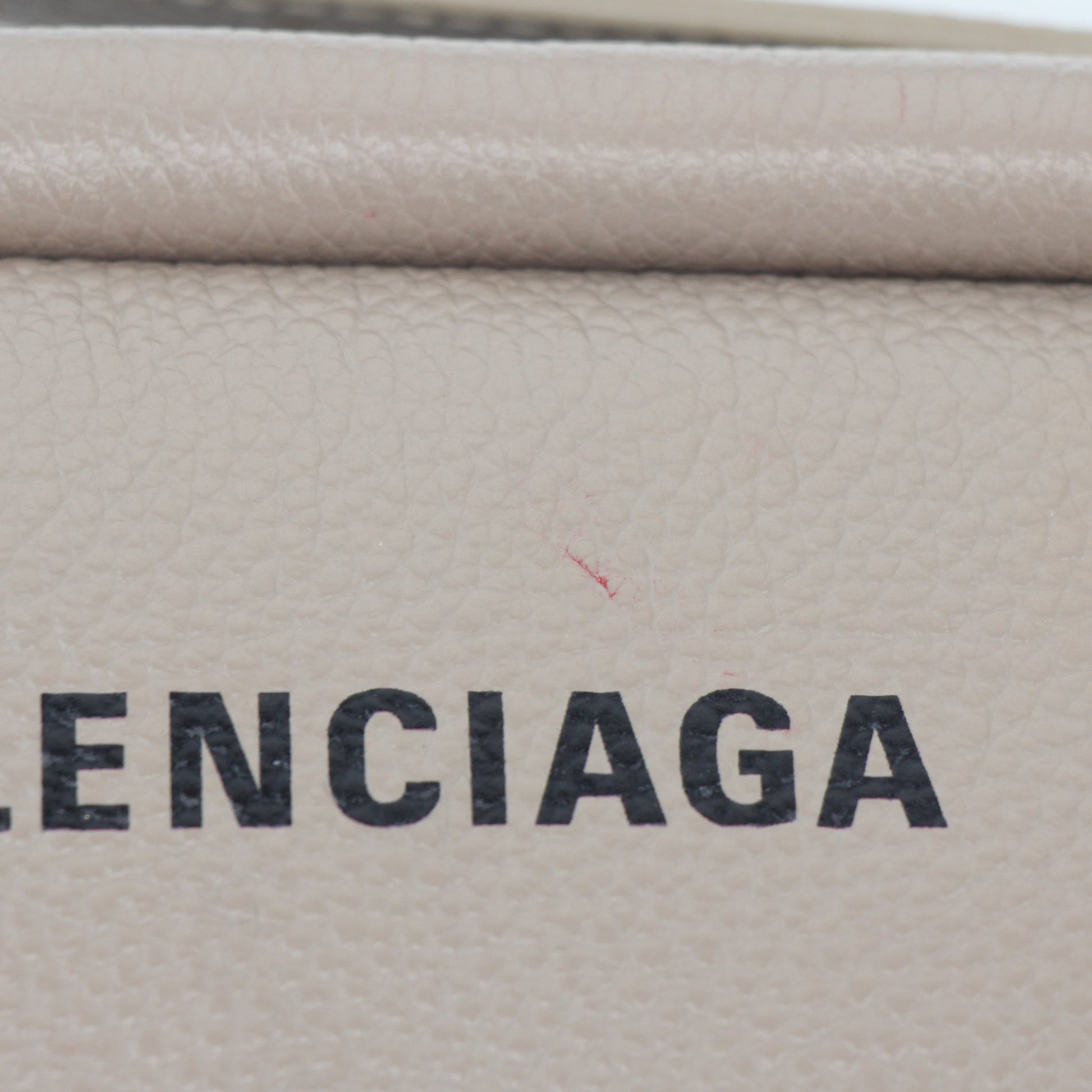 Beige Balenciaga camera handbag with gold accents, stylish everyday handbag from Gold & Beyond featuring a compact, modern design.