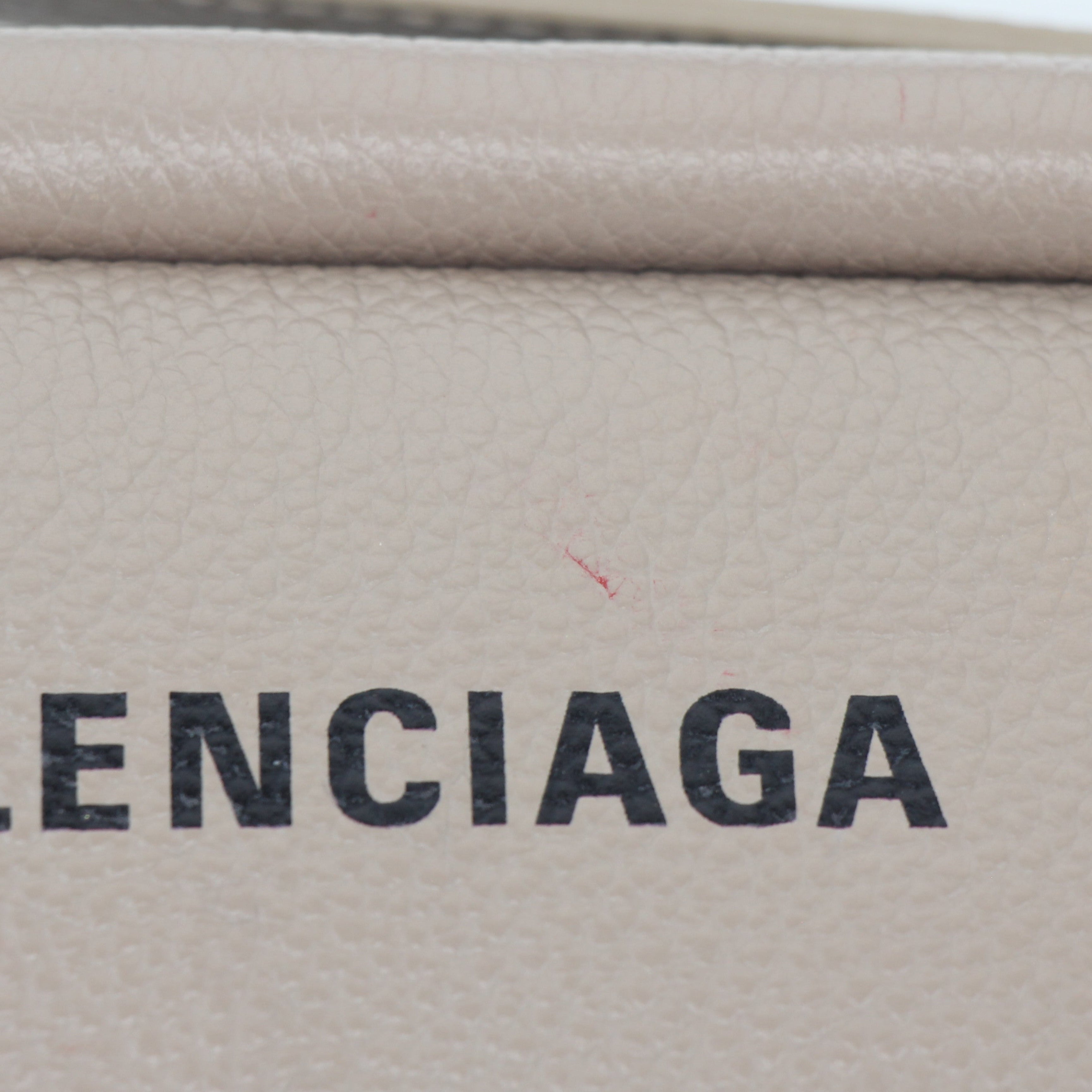 Beige Balenciaga camera handbag with gold accents, stylish everyday handbag from Gold & Beyond featuring a compact, modern design.