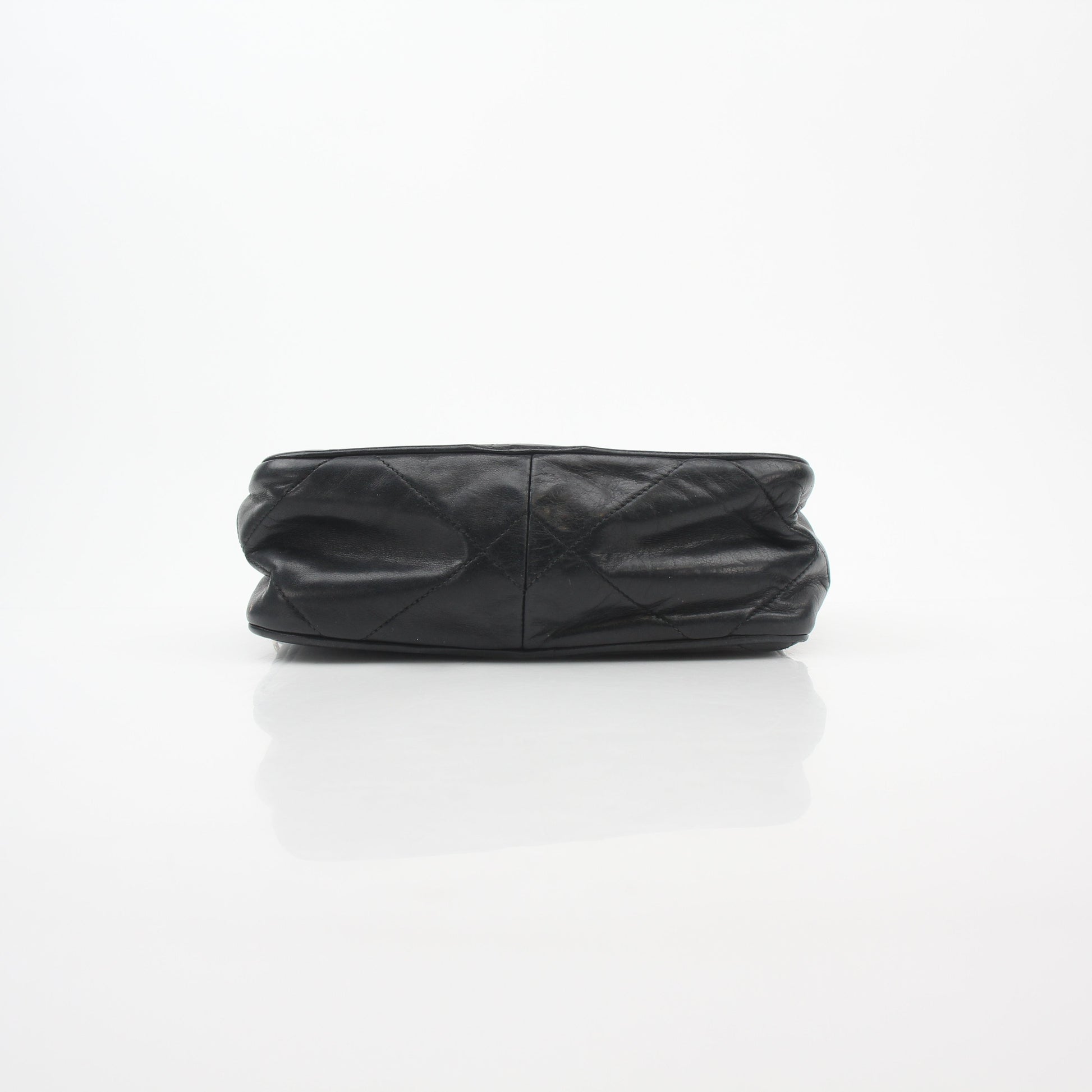 Black vintage Chanel quilted tassel camera bag handbag with gold chain strap and classic design.