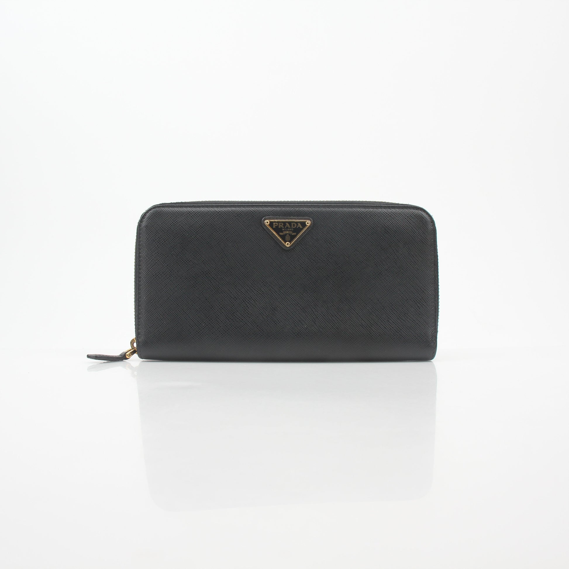 Prada black saffiano leather triangle zip-around wallet with gold-tone hardware, featuring a compact and stylish design.