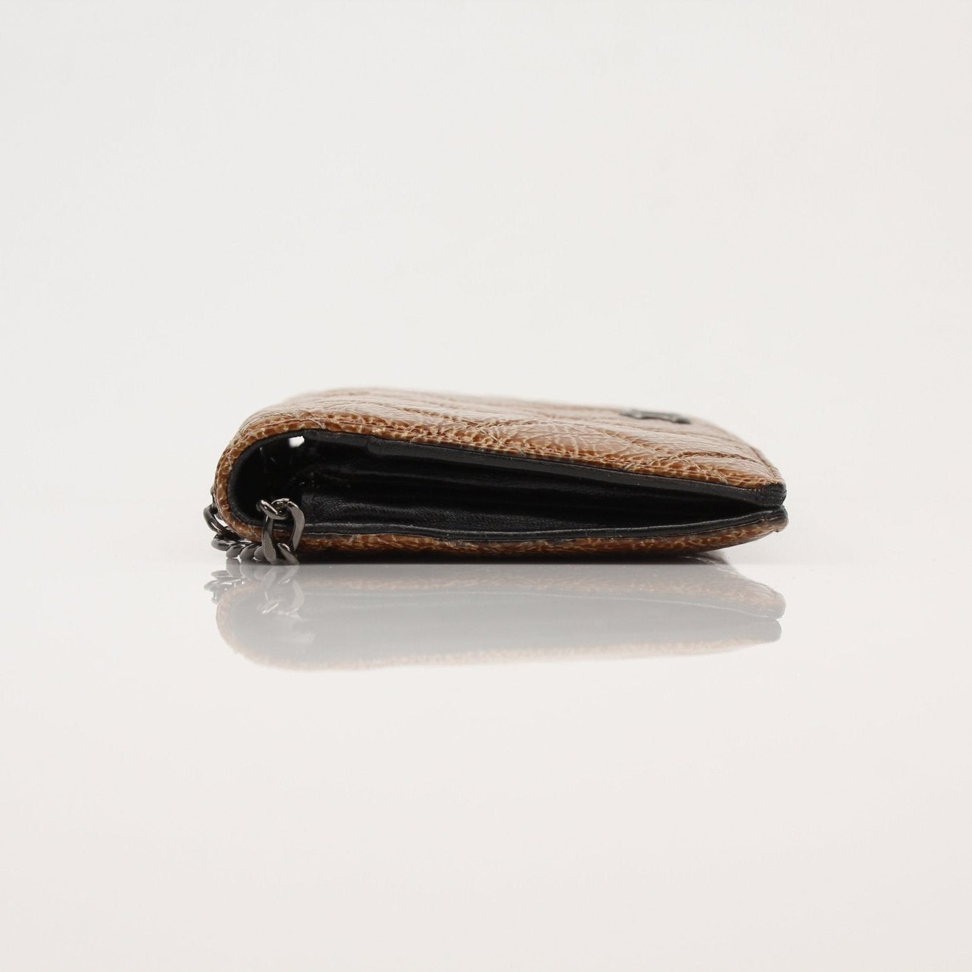 Chanel Crinkled Patent Wallet on Chain in black with gold hardware, featuring multiple card slots and a chain strap.