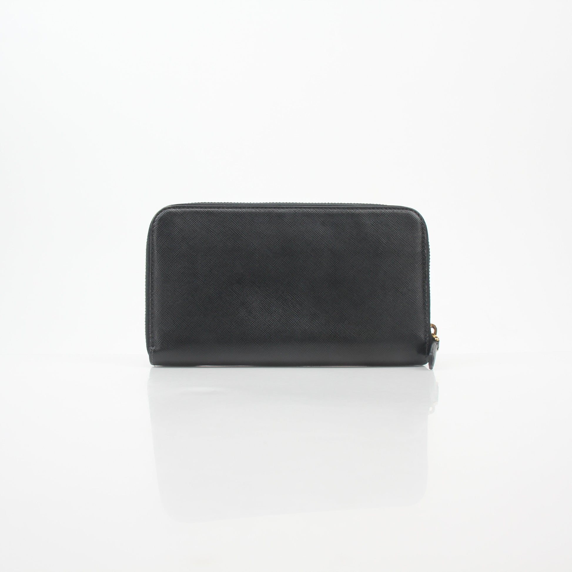 Prada black saffiano leather zip-around wallet with metal logo, featuring a sleek design and multiple card slots.
