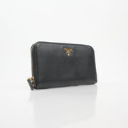 Prada black saffiano leather zip-around wallet with metal logo, featuring a sleek design and multiple card slots.
