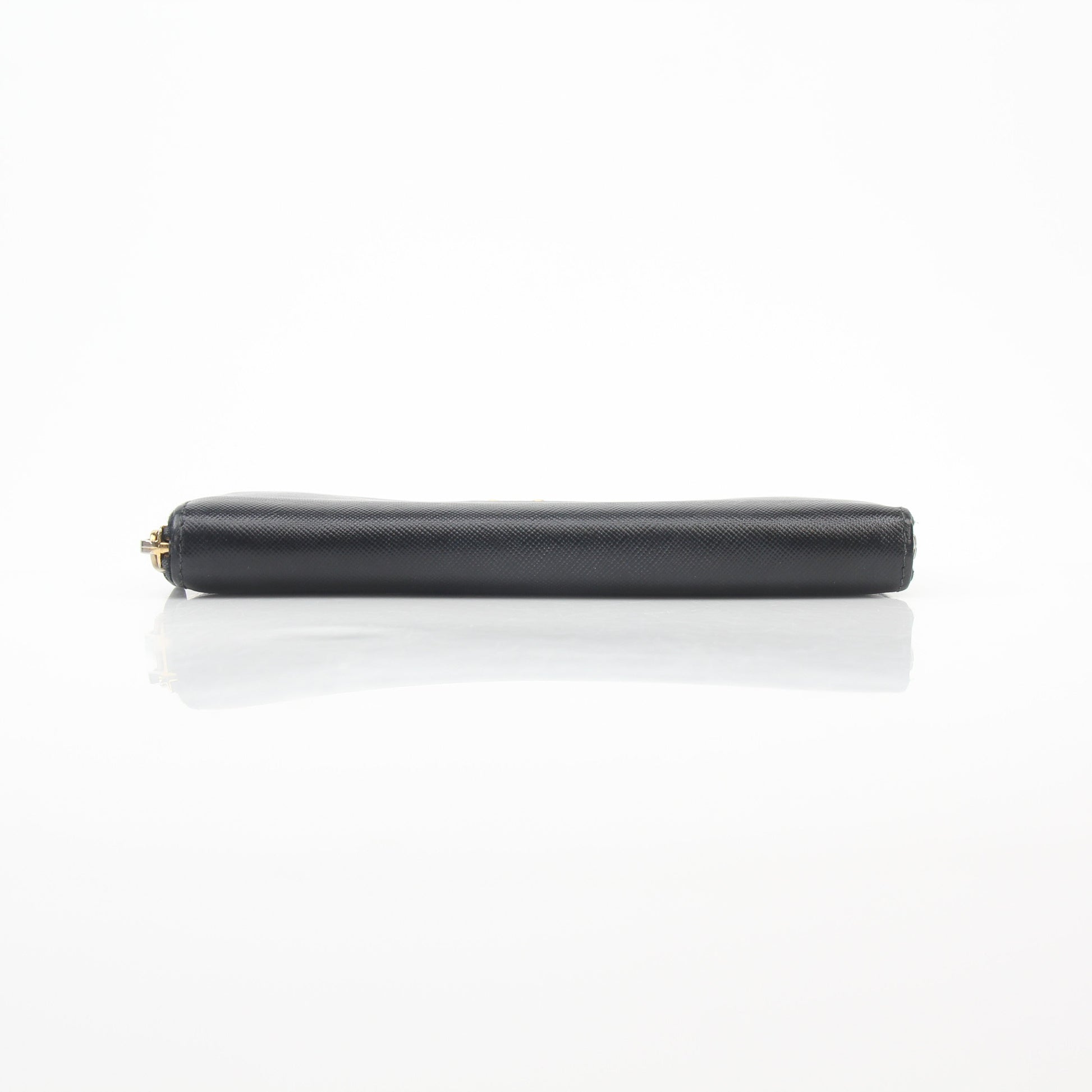 Prada black saffiano leather zip-around wallet with metal logo, featuring gold hardware and multiple card slots.