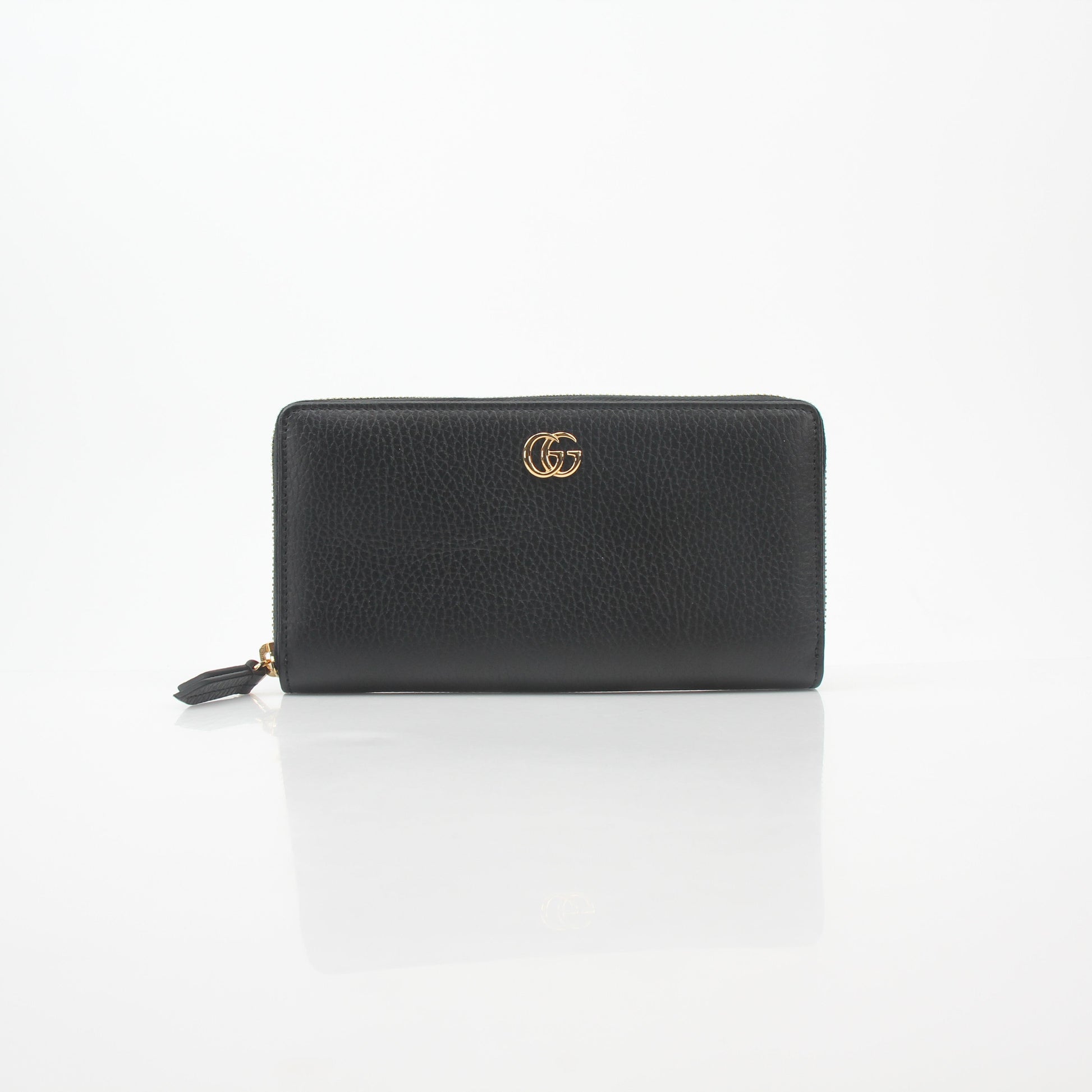 Gucci Black GG Marmont zip-around wallet with gold-tone hardware and quilted chevron leather design.