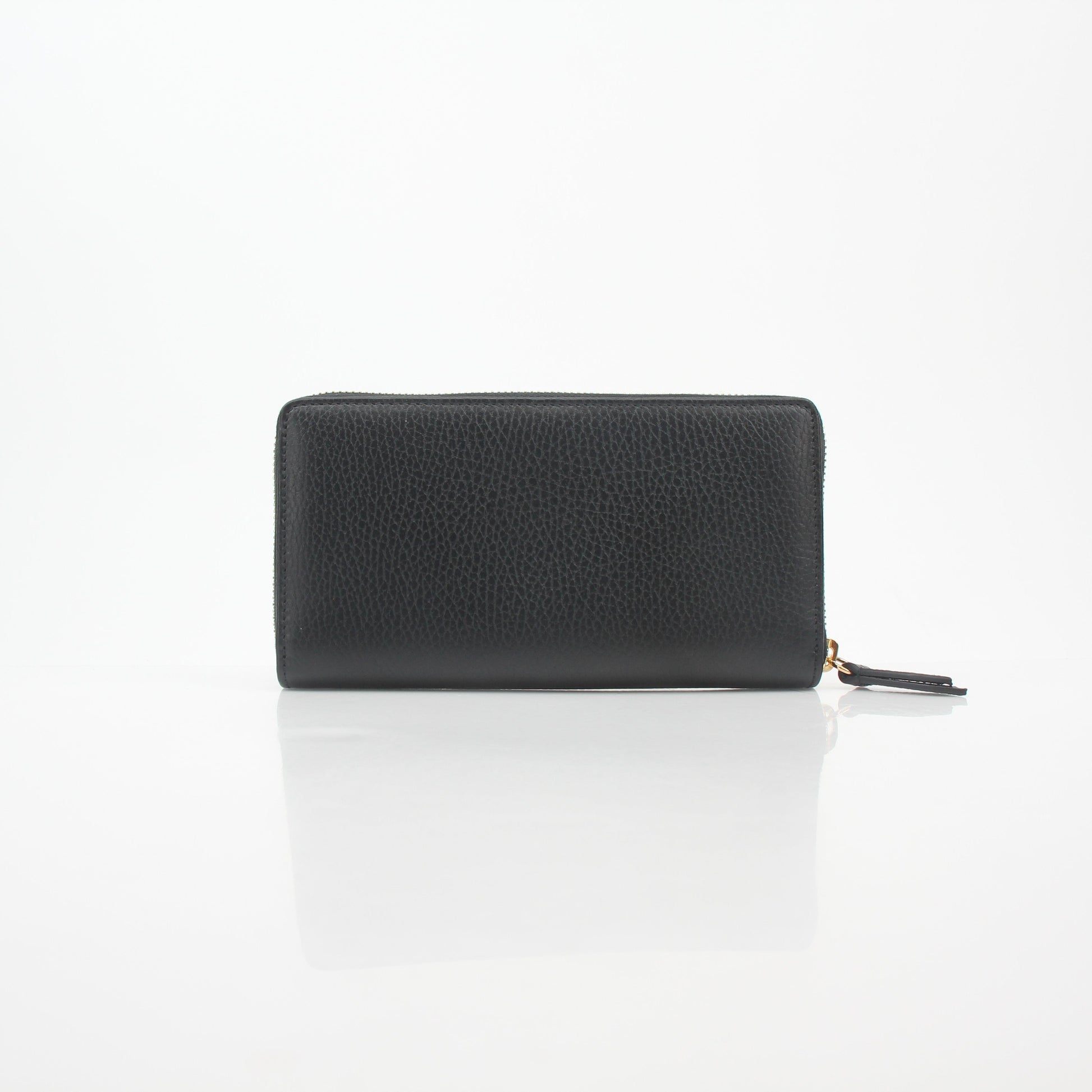 Gucci black GG Marmont zip-around wallet with gold-toned hardware and quilted chevron leather design.