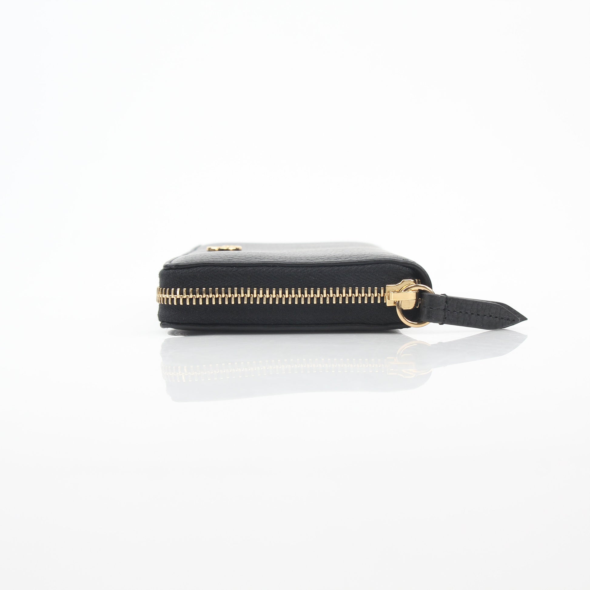 Gucci Black GG Marmont zip-around wallet with gold-tone hardware and chevron quilted leather, displayed on a neutral background.