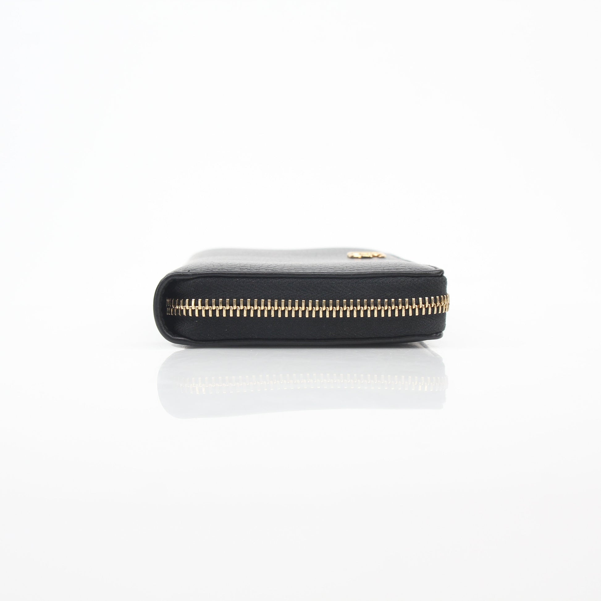 Gucci black GG Marmont zip-around wallet with gold-tone hardware and embossed logo, displayed open to show interior compartments.