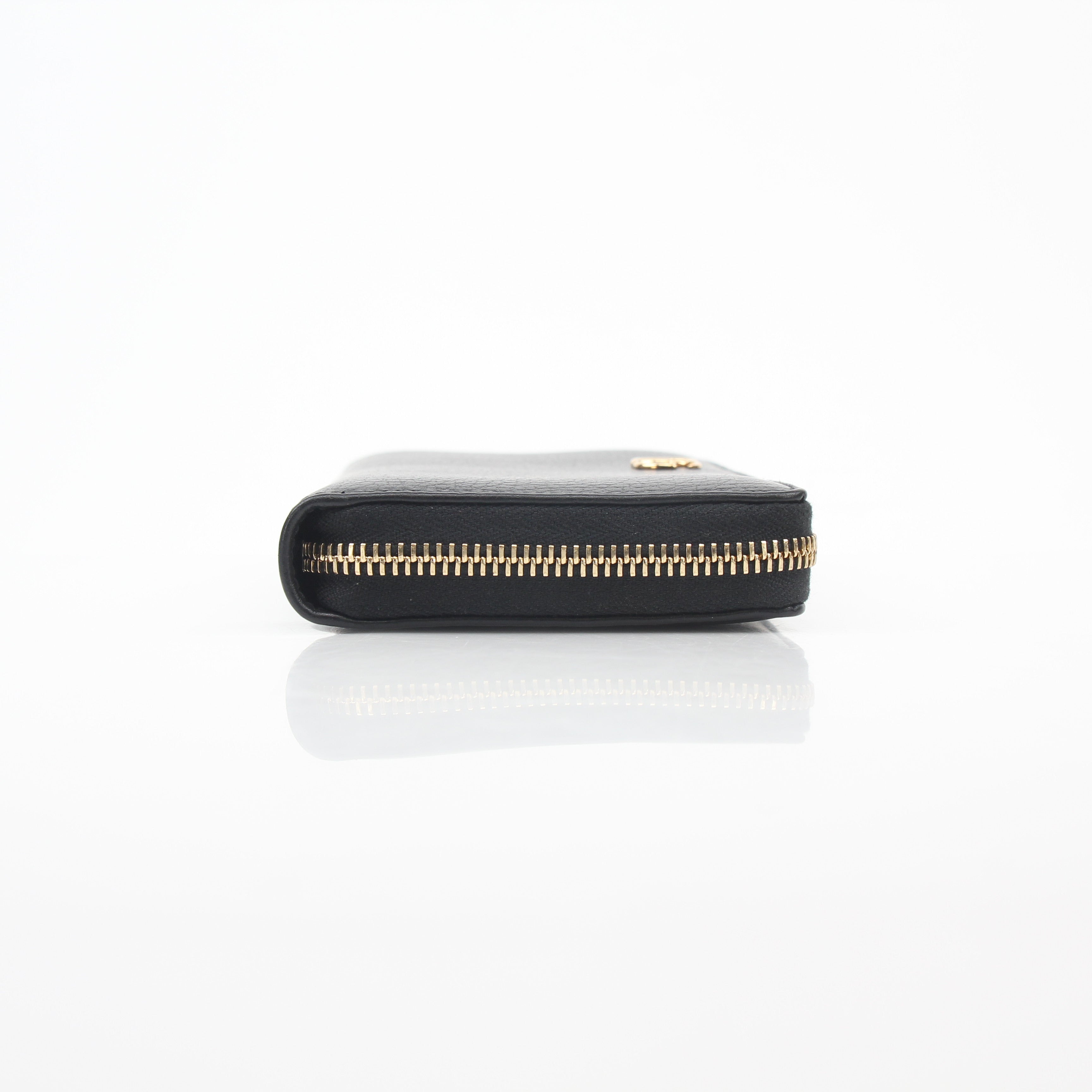 Gucci black GG Marmont zip-around wallet with gold-tone hardware and embossed logo, displayed open to show interior compartments.