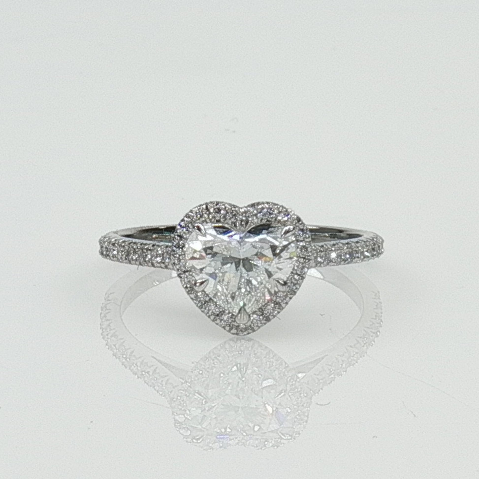 Gold & Beyond Tiffany & Co. Soleste heart-shaped diamond ring jewelry with a sparkling diamond centerpiece on a sleek band.