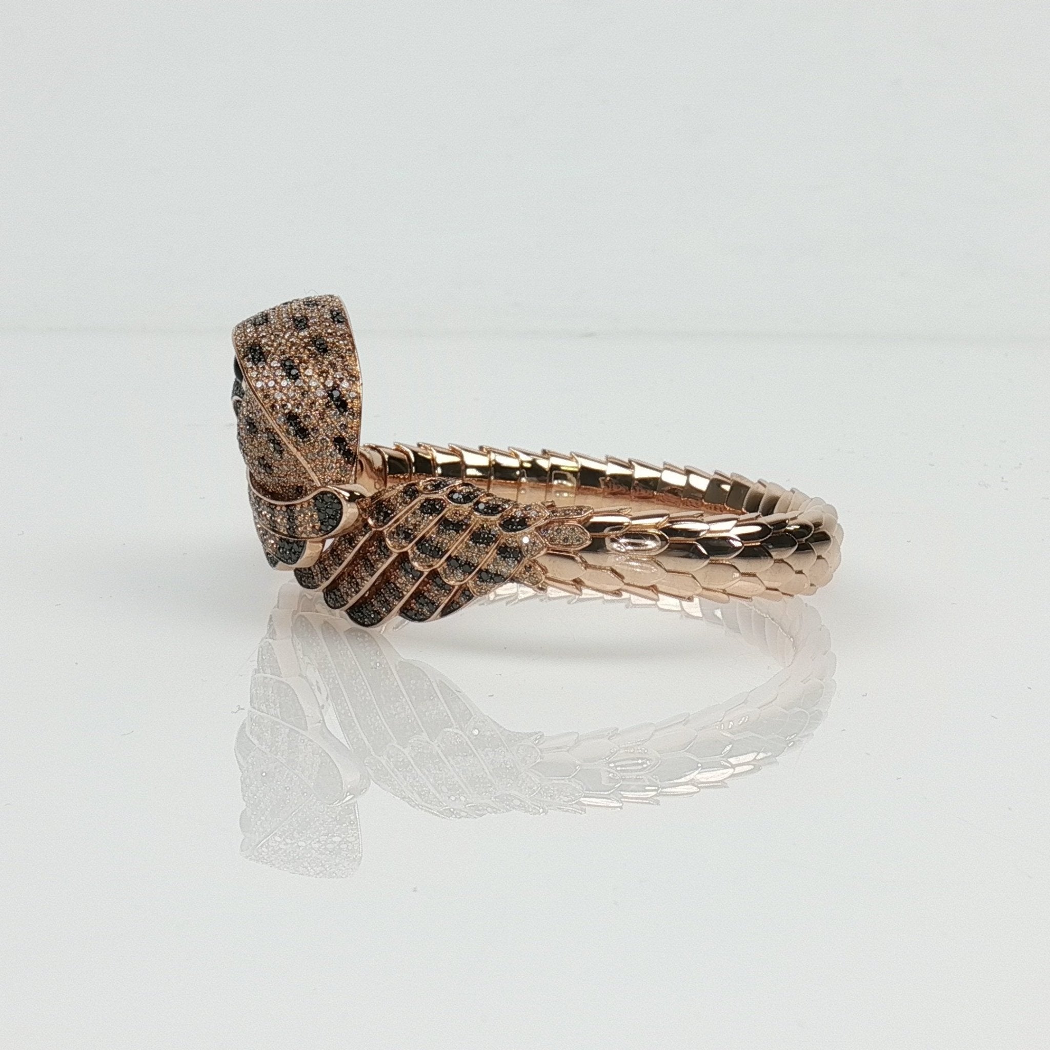 Roberto Coin Falcon Diamond bracelet featuring gold jewelry with sparkling diamonds, elegant design, displayed on a neutral background.