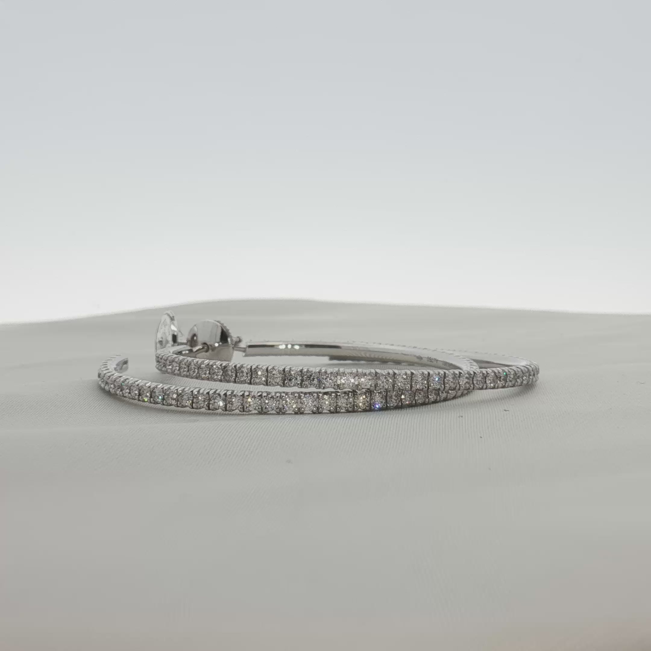 Load video: Cartier Diamond Hoop Earrings