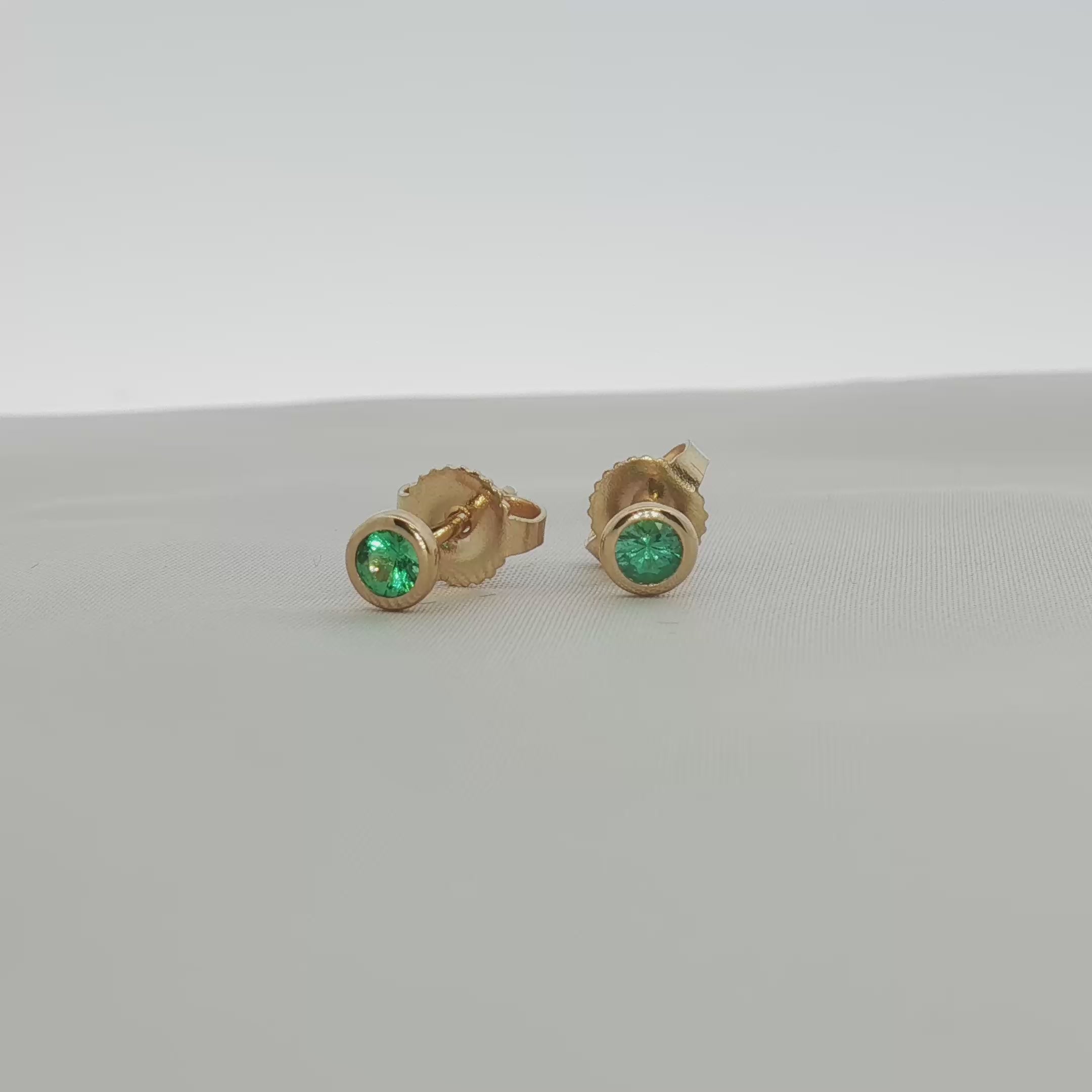 Load video: Tiffany &amp; Co. 18K Yellow Gold Emerald Stud Earrings