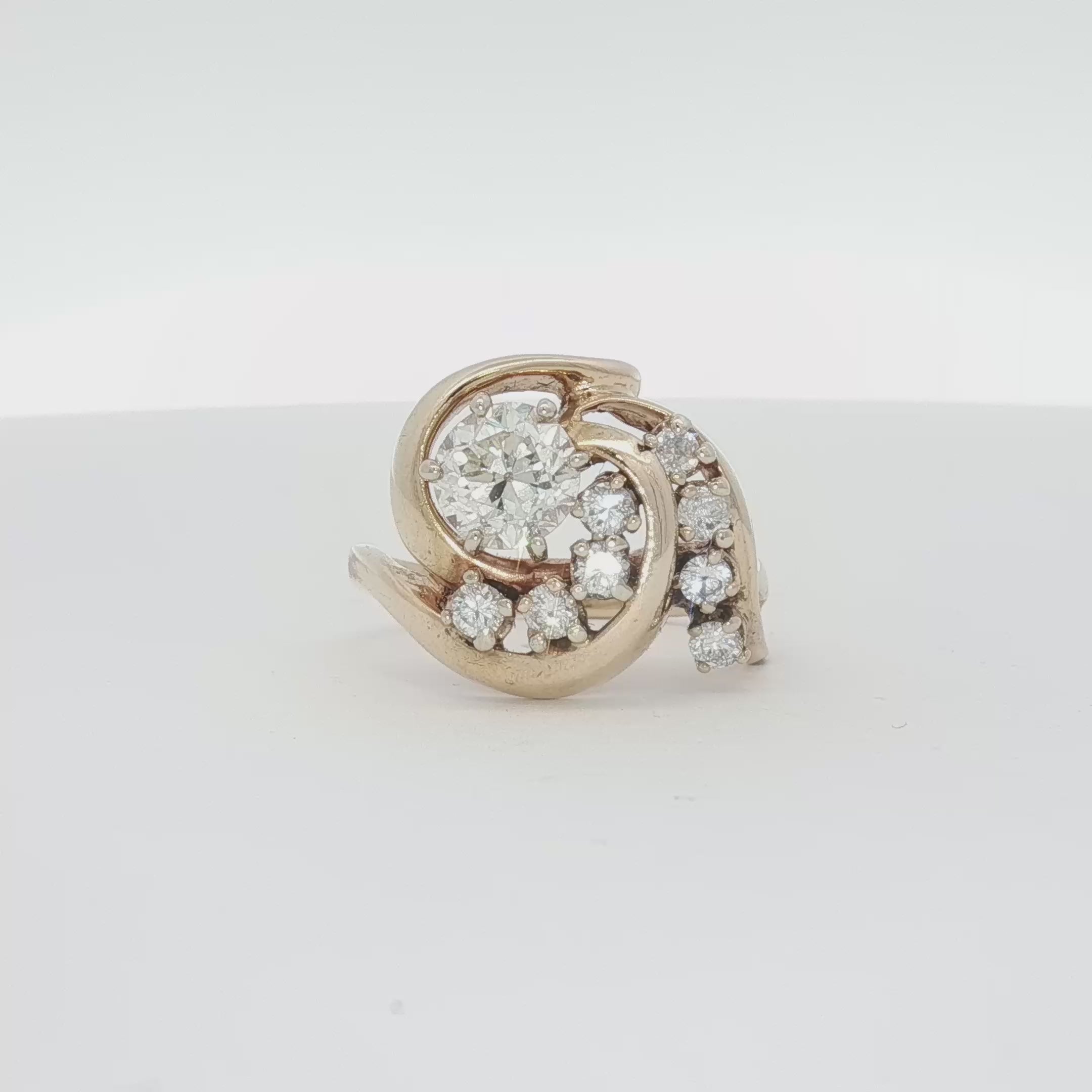 Load video: 14K Yellow Gold Diamond Swirl Ring