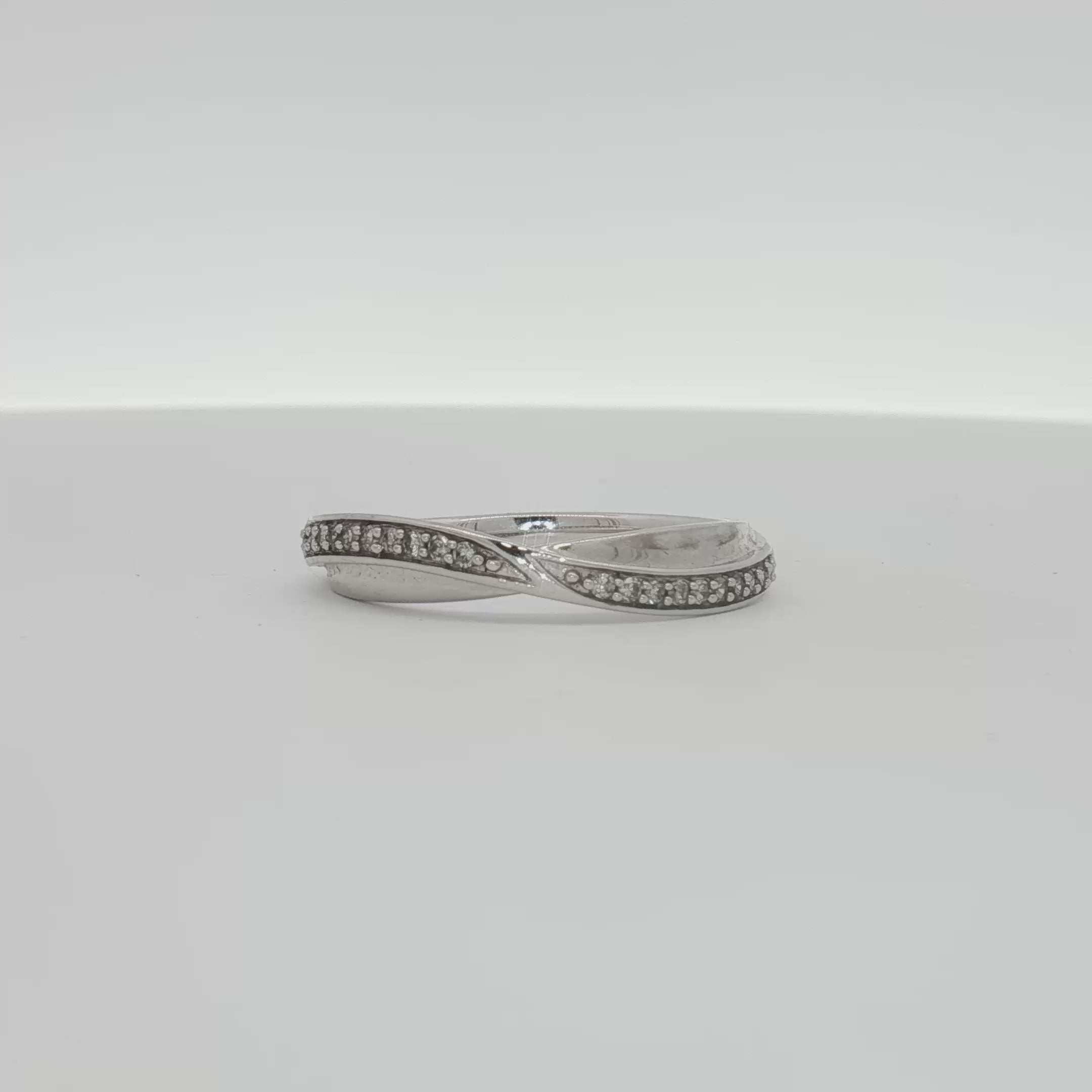 Load video: 10K White Gold Diamond Twist Band Ring